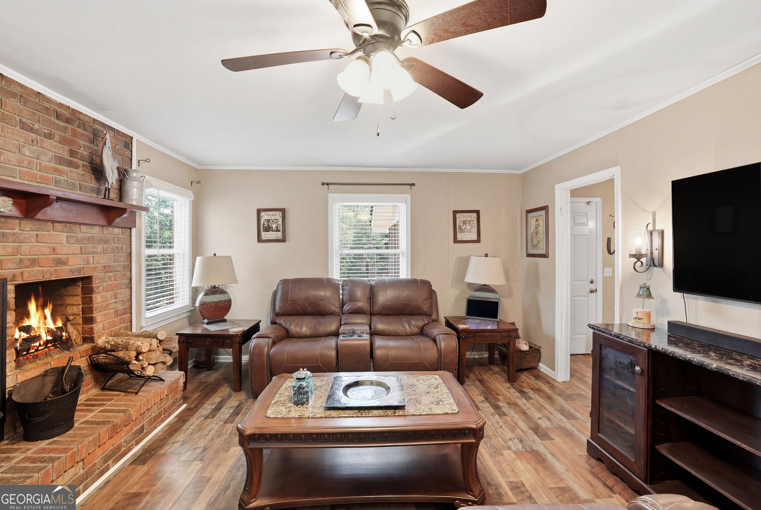 326 Remsdale Road Toccoa, GA 30577 - Photo 12 of 37 a living room with furniture a flat screen tv and a fireplace