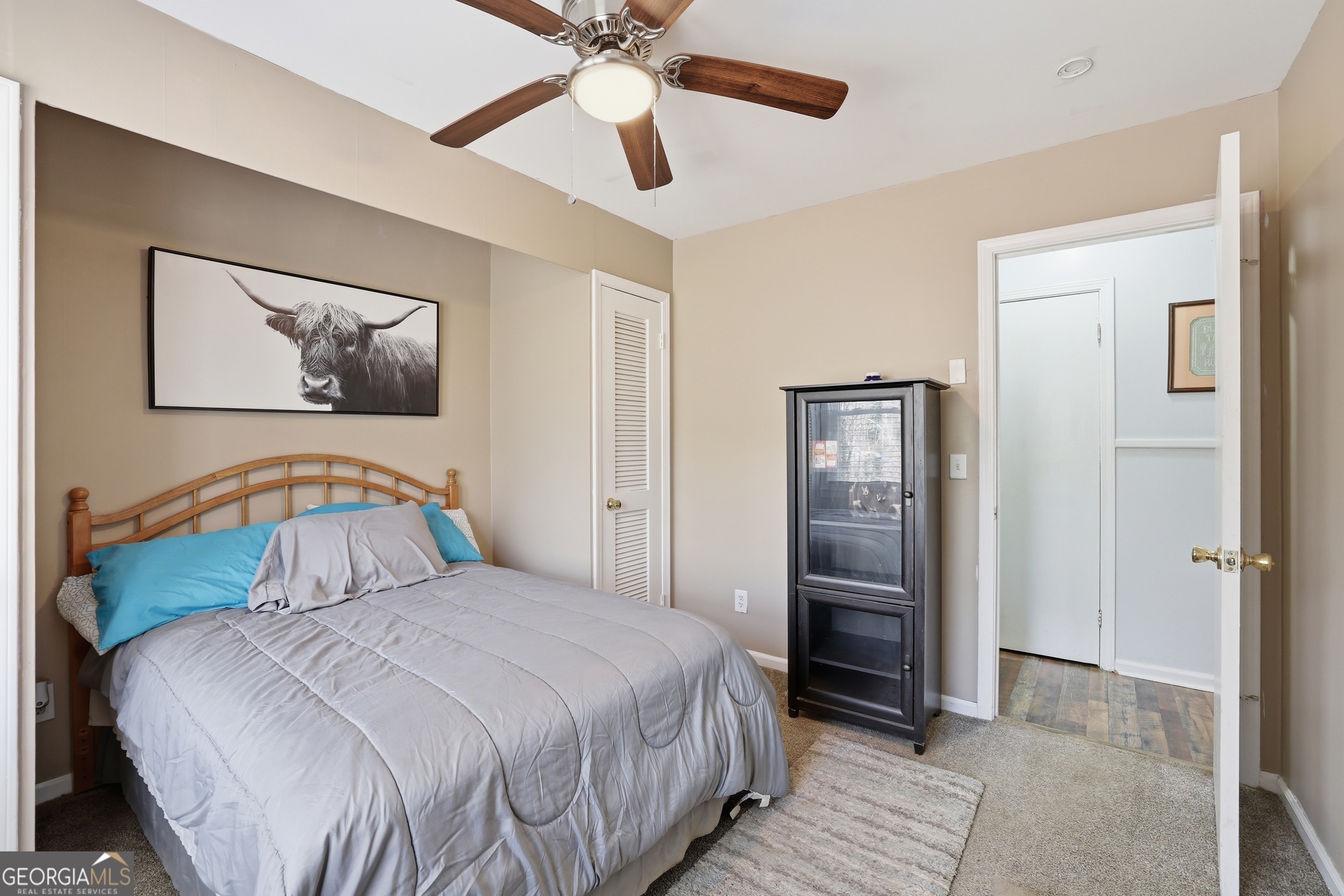 326 Remsdale Road Toccoa, GA 30577 - Photo 18 of 37 a bedroom with a bed and a chandelier