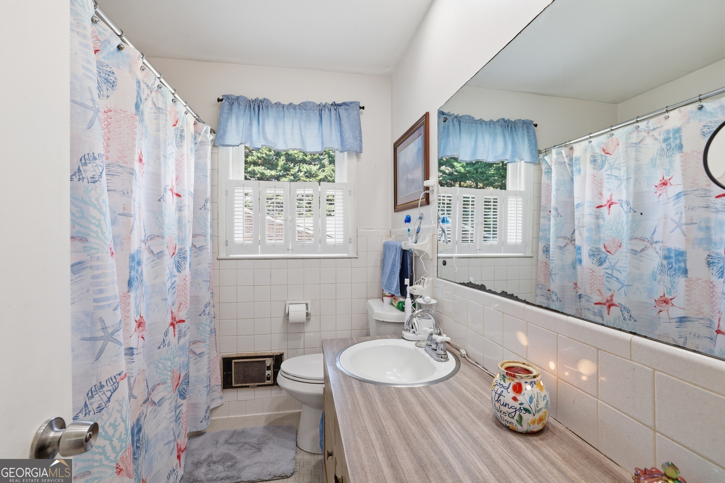 326 Remsdale Road Toccoa, GA 30577 - Photo 21 of 37 a bathroom with a sink double vanity and a mirror
