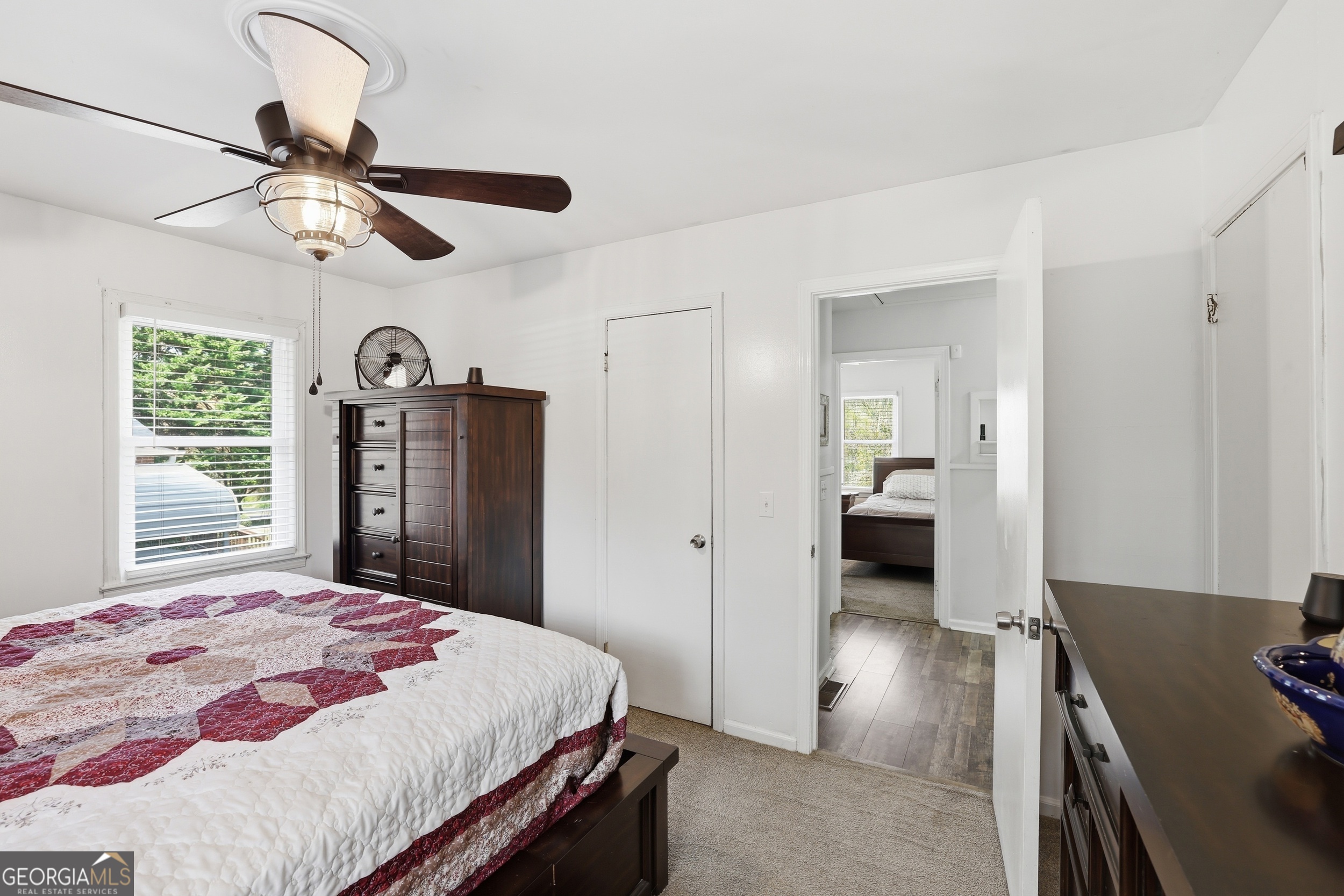 326 Remsdale Road Toccoa, GA 30577 - Photo 22 of 37 a bedroom with a bed and a chandelier