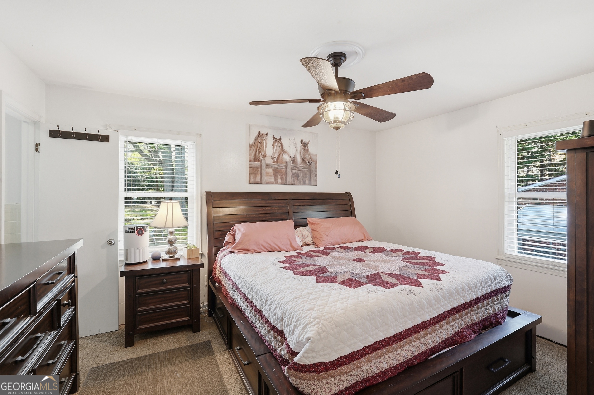 326 Remsdale Road Toccoa, GA 30577 - Photo 23 of 37 a bedroom with a bed and a ceiling fan