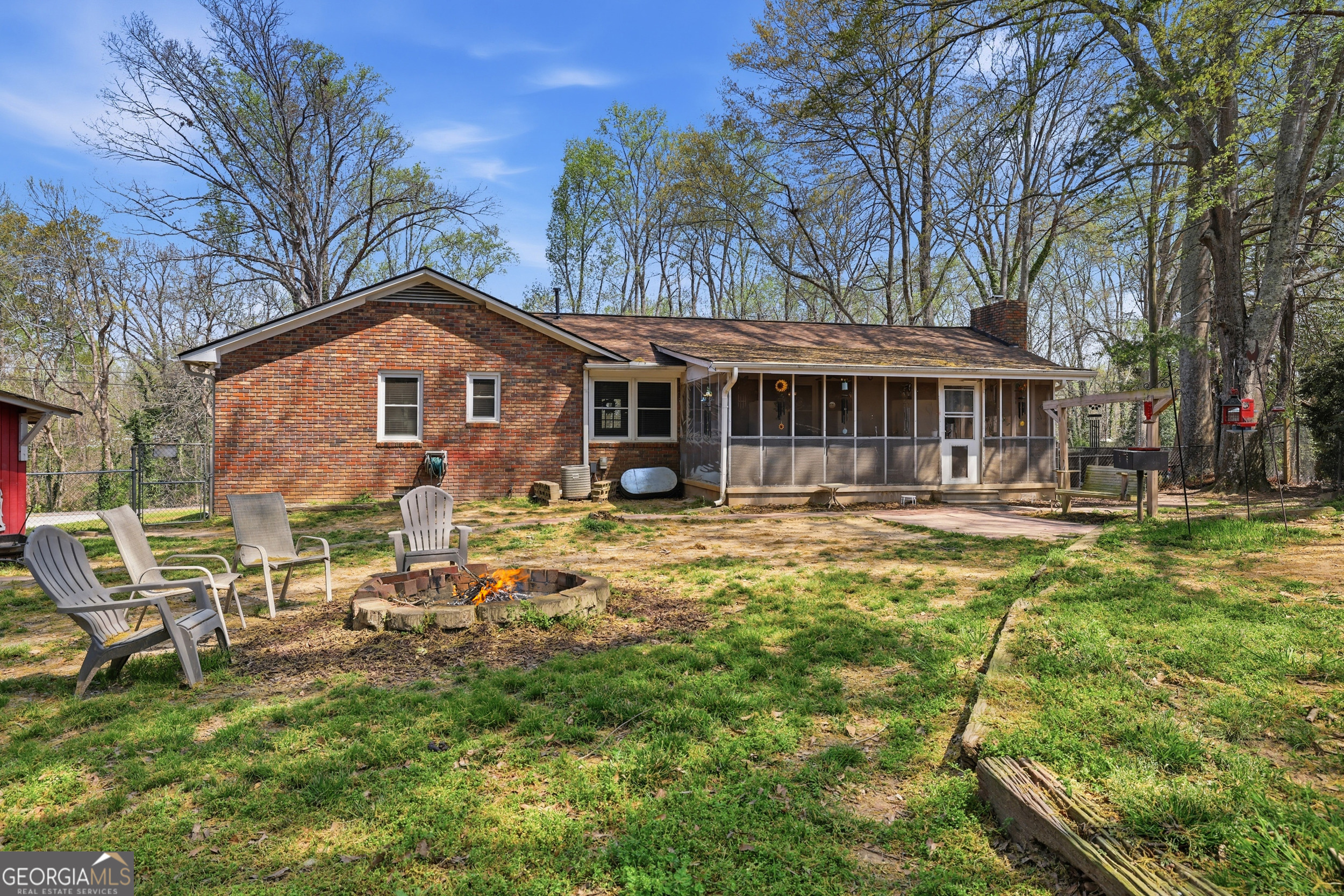 326 Remsdale Road Toccoa, GA 30577 - Photo 27 of 37 a front view of a house with a yard table and chairs