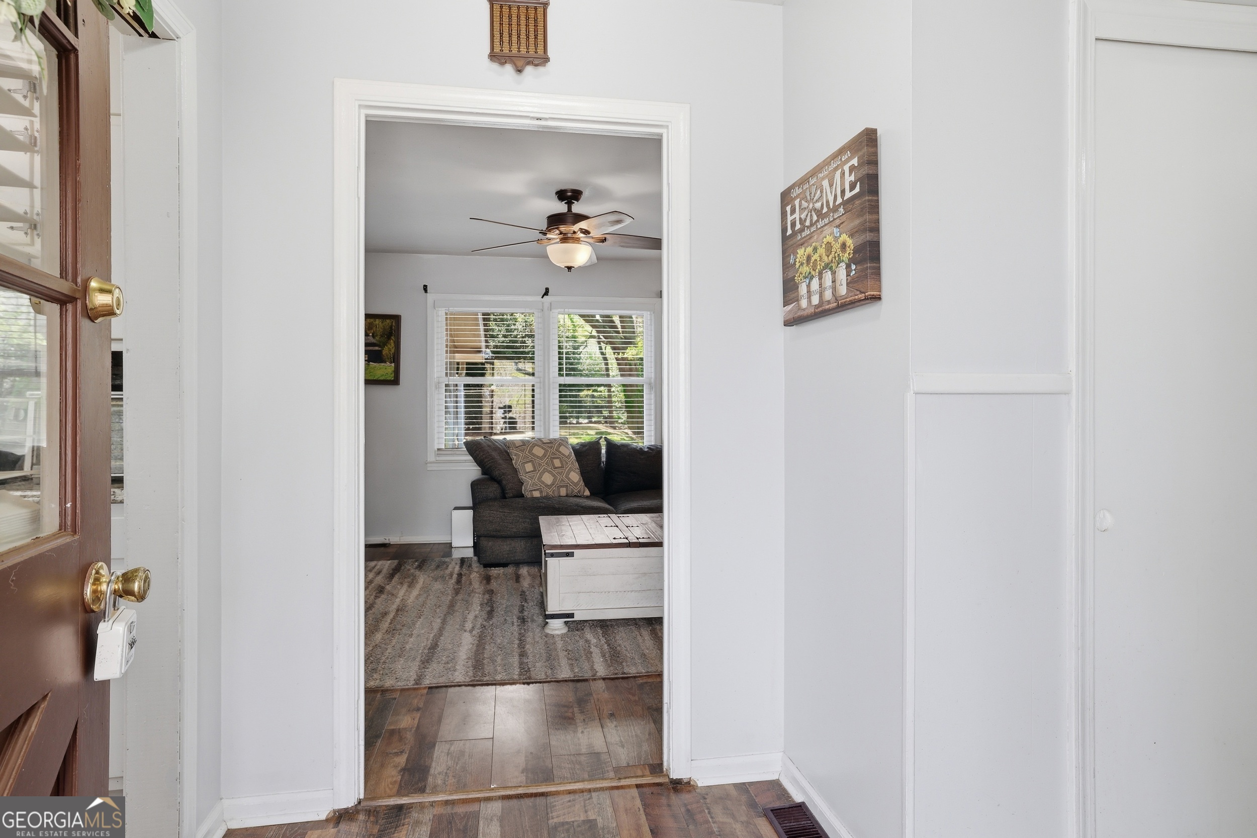 326 Remsdale Road Toccoa, GA 30577 - Photo 4 of 37 a view of hallway with chair and frames on wall