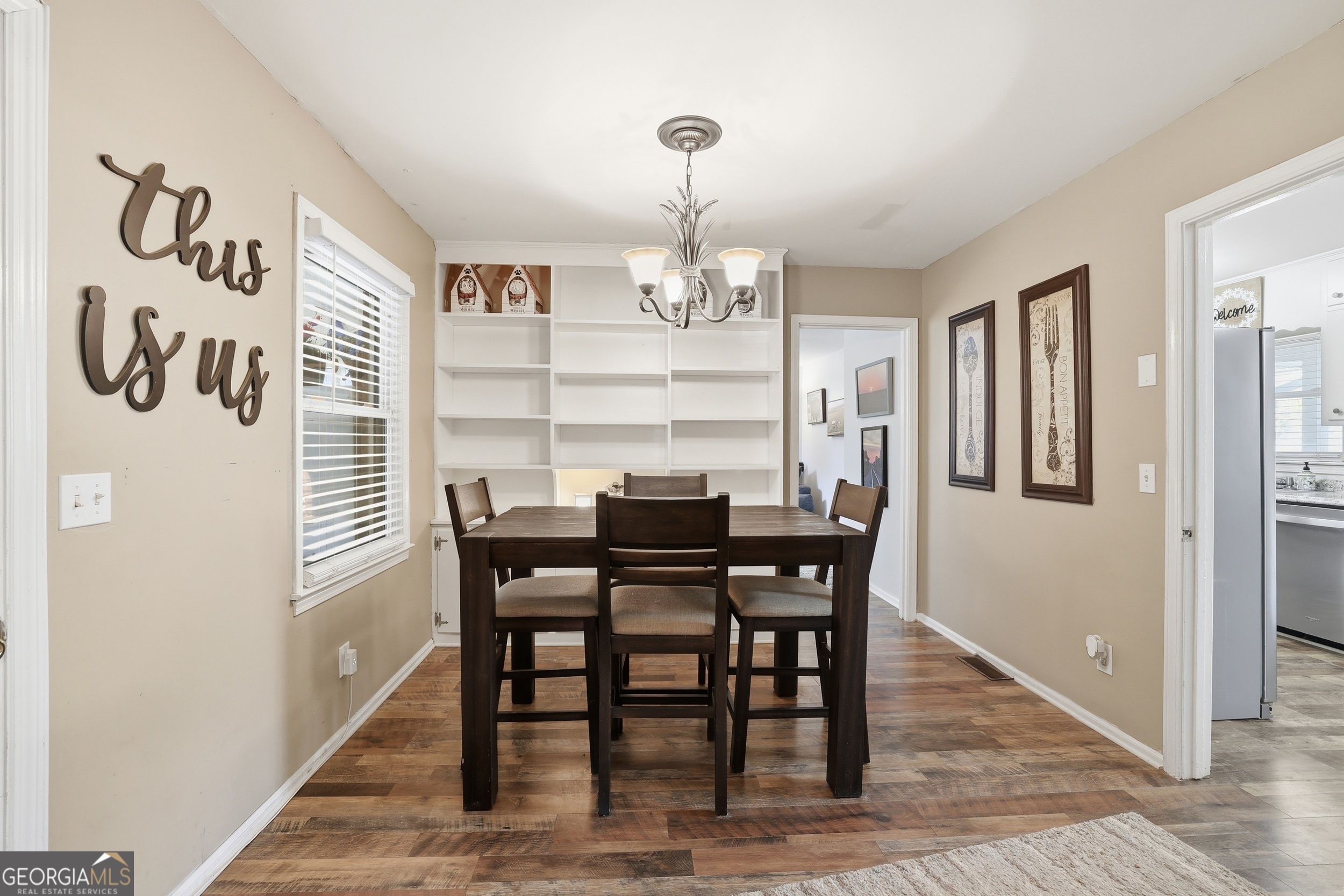 326 Remsdale Road Toccoa, GA 30577 - Photo 7 of 37 a view of a dining room with furniture window and wooden floor