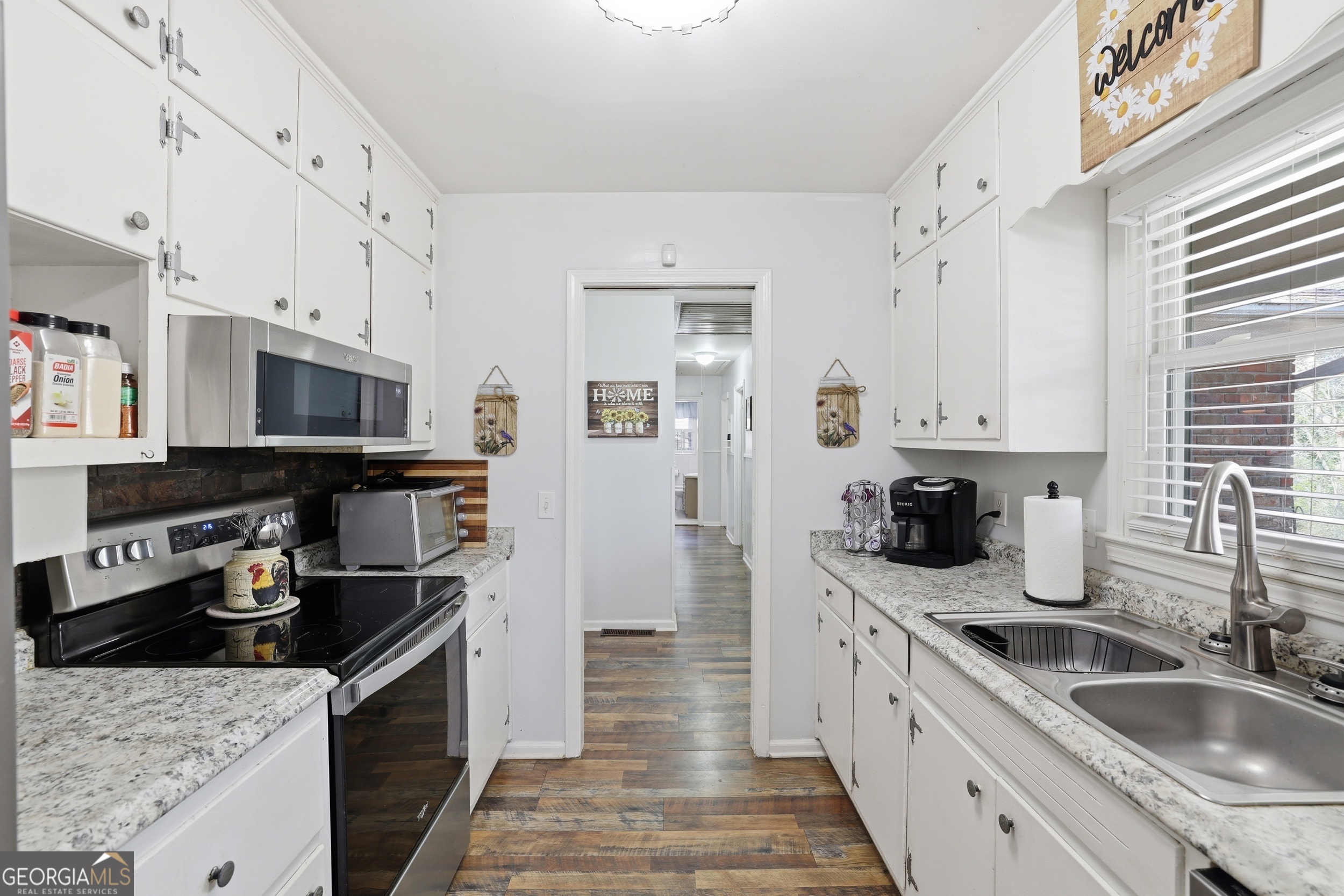 326 Remsdale Road Toccoa, GA 30577 - Photo 10 of 37 a kitchen with stainless steel appliances granite countertop a sink stove and refrigerator