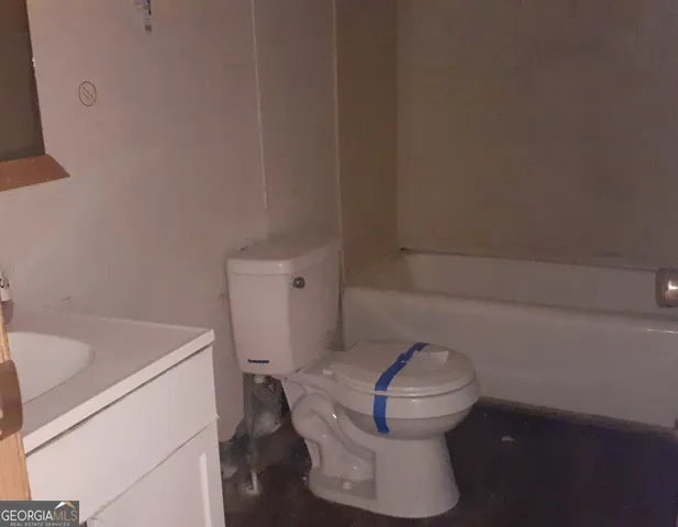 a bathroom with a toilet and a sink