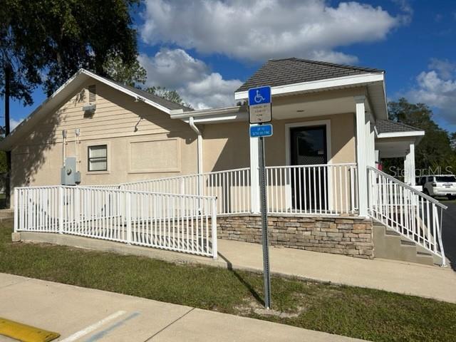 3143 Northeast 14th Street Ocala, FL 34470 - Photo 3 of 13 a view of a house with a small yard and wooden fence