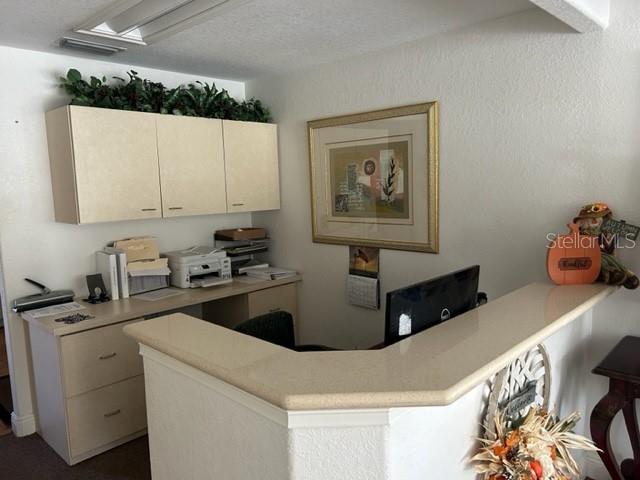 3143 Northeast 14th Street Ocala, FL 34470 - Photo 8 of 13 a kitchen with a refrigerator sink and white cabinets
