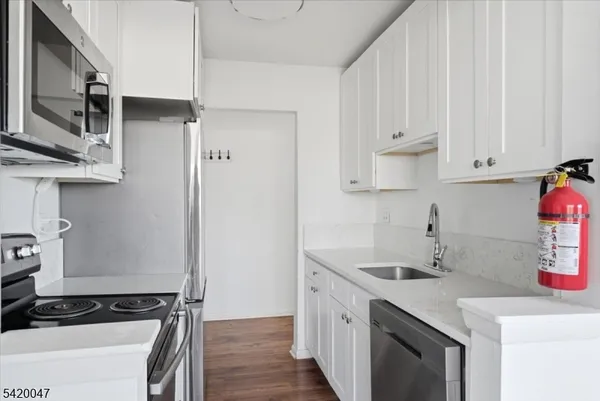 a kitchen with a sink and cabinets