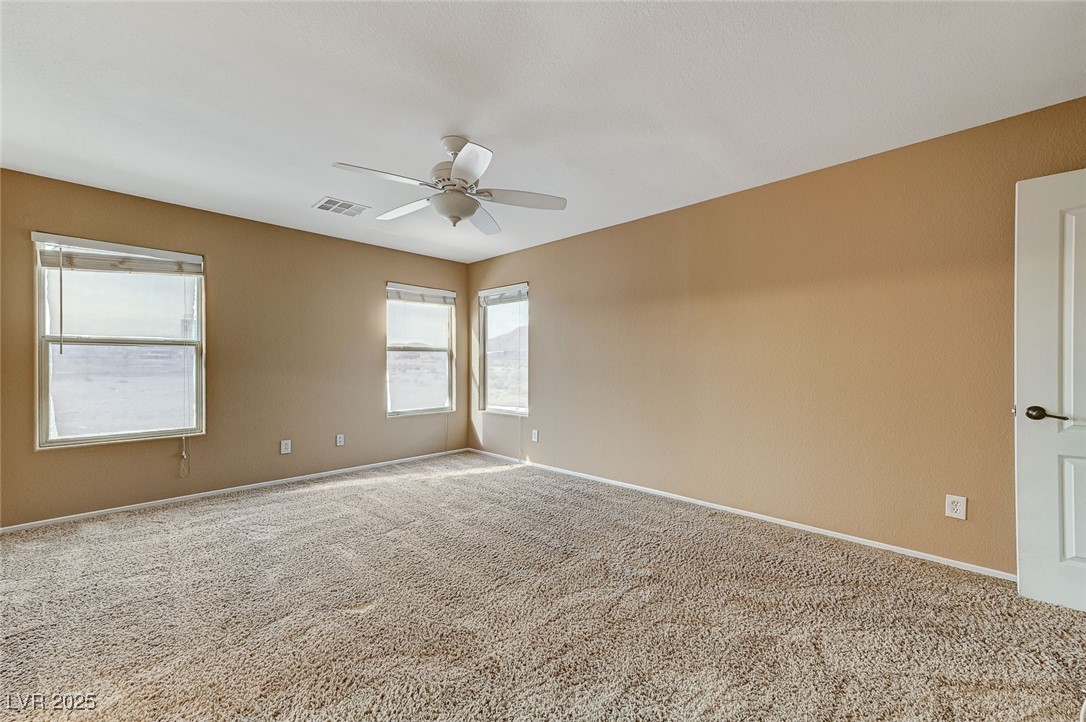 83 Lockheed Avenue Las Vegas, NV 89183 - Photo 16 of 28 Carpeted empty room with baseboards