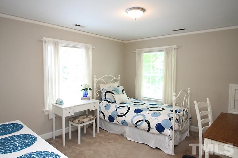 2400 White Oak Road Raleigh, NC 27609 - Photo 16 of 20 a bedroom with a bed and a window