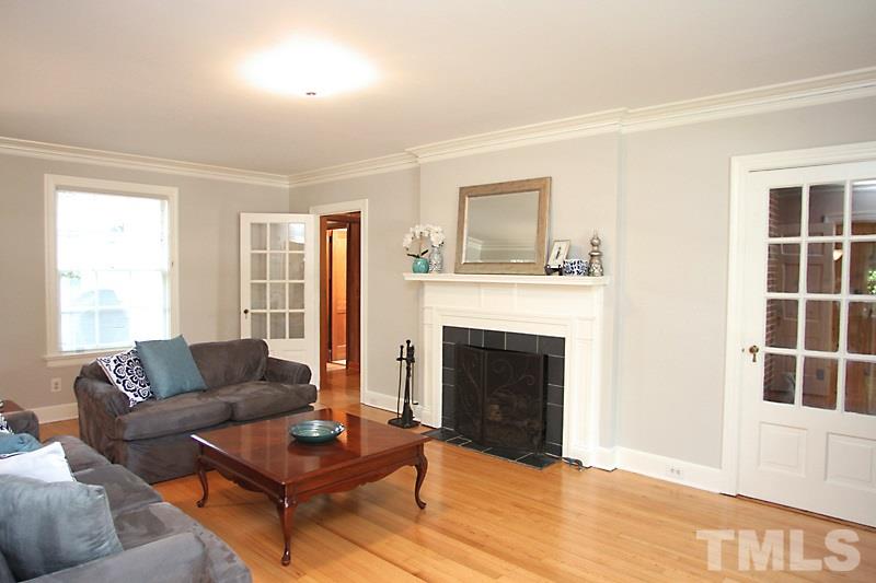 2400 White Oak Road Raleigh, NC 27609 - Photo 2 of 20 a living room with furniture and a fireplace