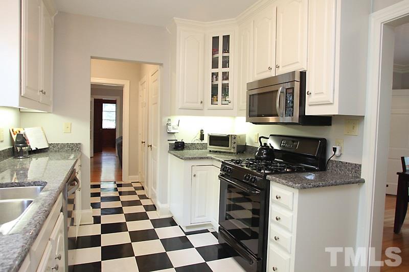 2400 White Oak Road Raleigh, NC 27609 - Photo 6 of 20 a kitchen with granite countertop stainless steel appliances a sink a stove and cabinets