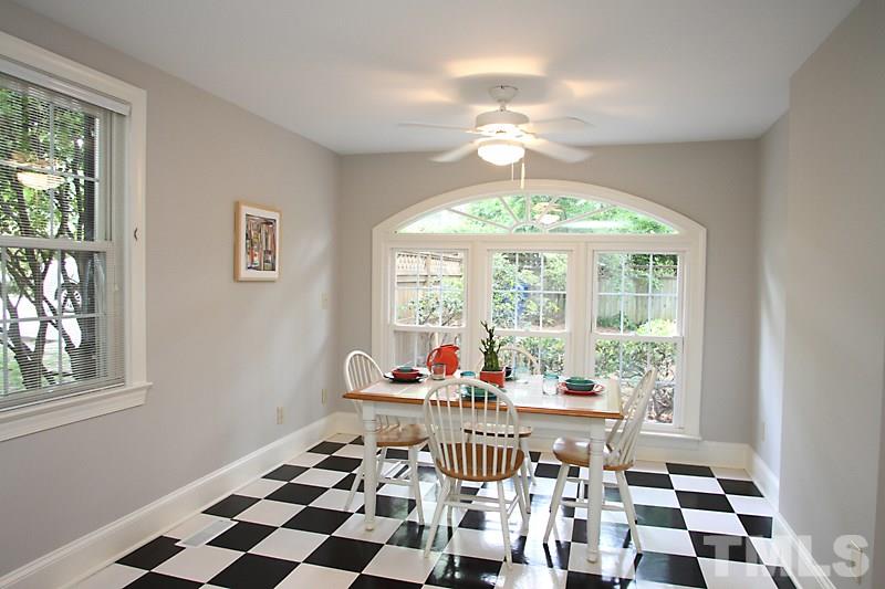 2400 White Oak Road Raleigh, NC 27609 - Photo 7 of 20 a living room with furniture and a floor to ceiling window