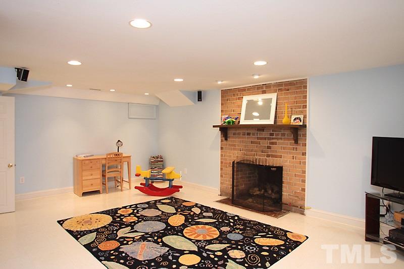 2400 White Oak Road Raleigh, NC 27609 - Photo 8 of 20 a living room with furniture and a fireplace