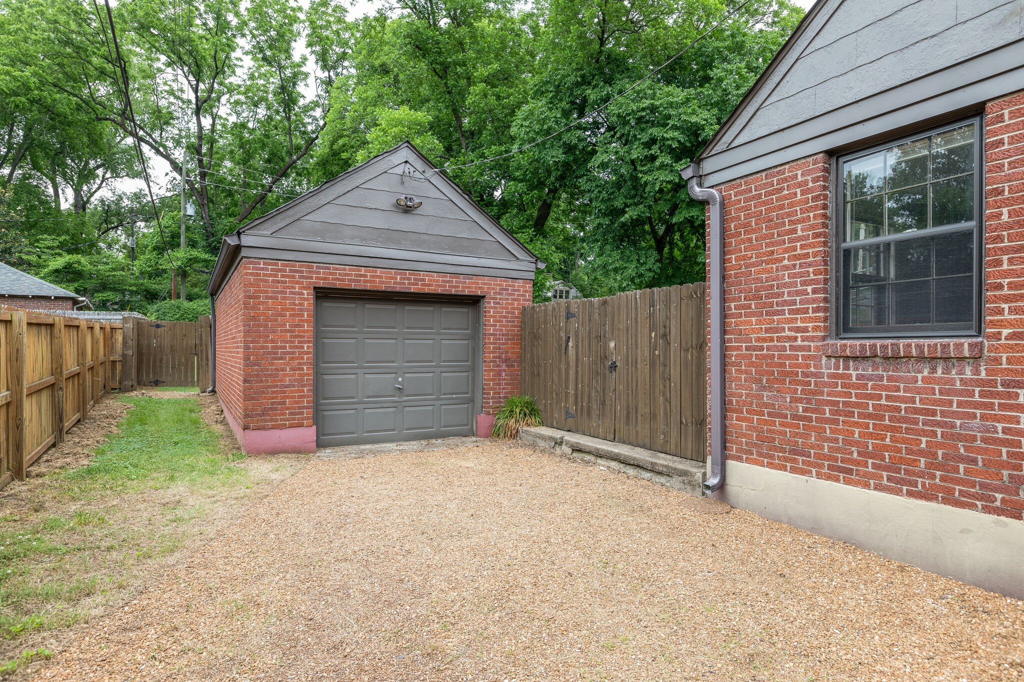3910 Valley Road Nashville, TN 37205 - Photo 28 of 41 a front view of a house with yard and garage
