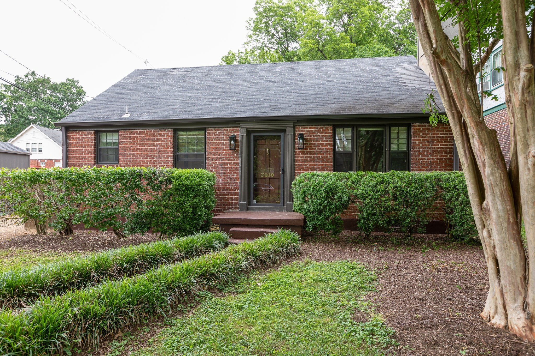 3910 Valley Road Nashville, TN 37205 - Photo 36 of 41 a front view of a house with garden
