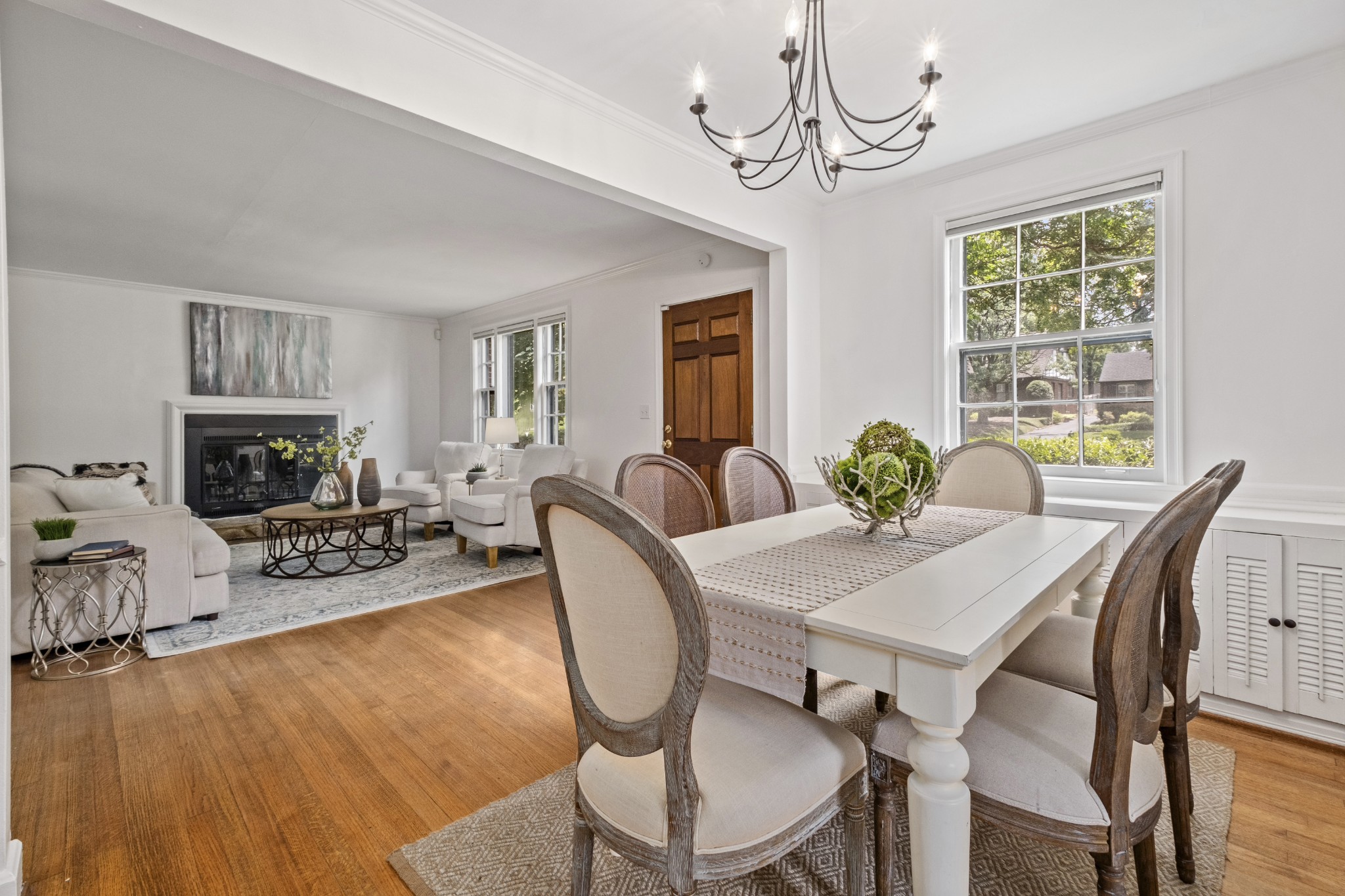 3910 Valley Road Nashville, TN 37205 - Photo 8 of 41 a view of a dining room with furniture a chandelier and wooden floor