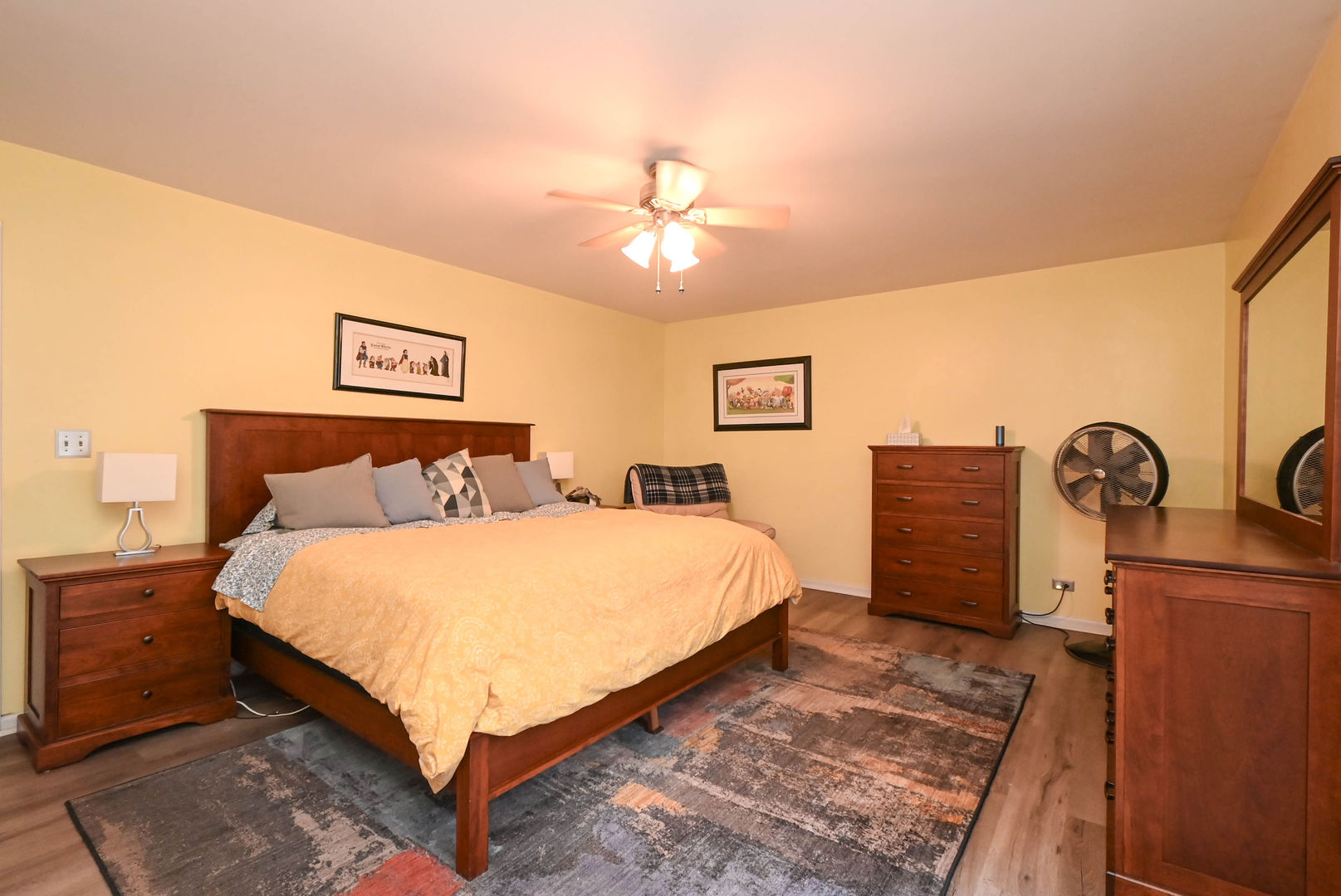 1333 Regency Lane Round Lake, IL 60073 - Photo 16 of 31 a bed room with a bed and a chandelier