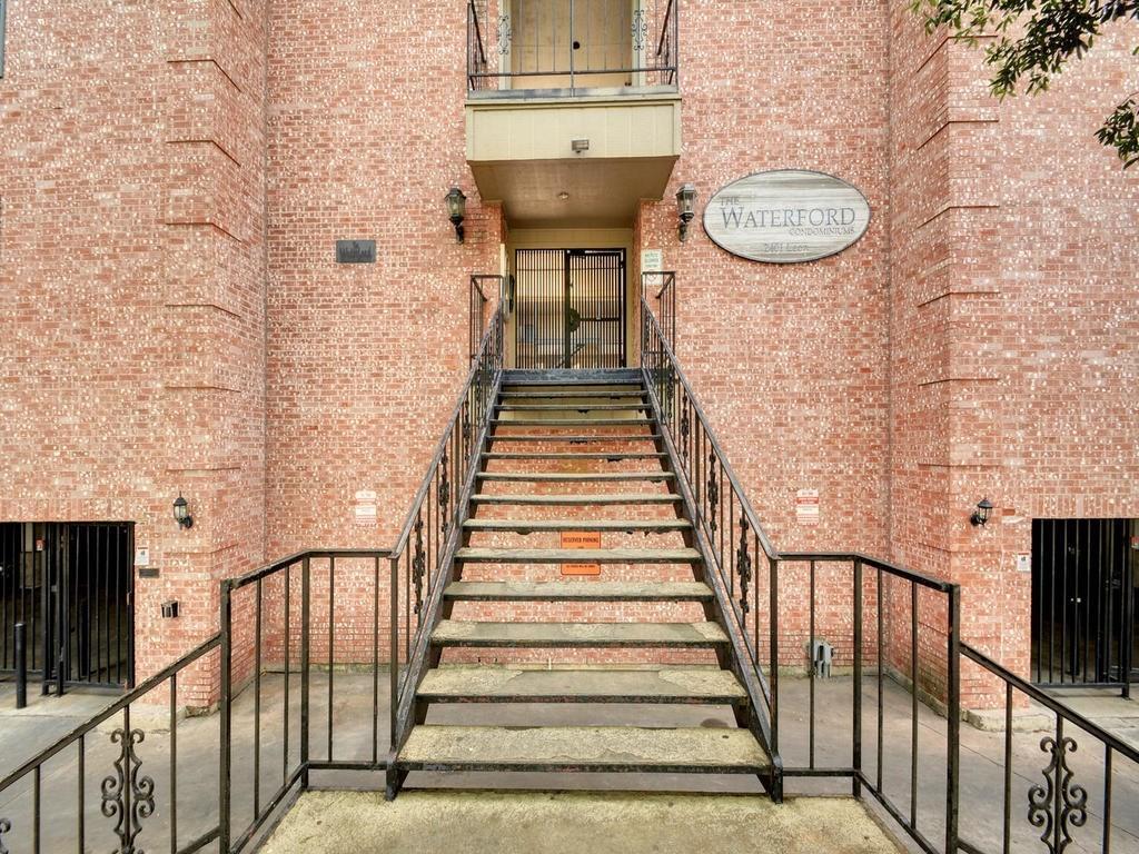 2401 Leon Street, Unit 201 Austin, TX 78705 - Photo 12 of 13 a view of a hallway with wooden floor and staircase
