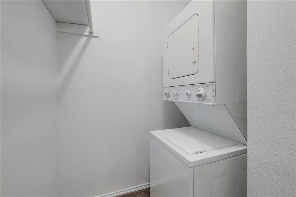 2401 Leon Street, Unit 201 Austin, TX 78705 - Photo 7 of 13 a utility room with dryer and washer