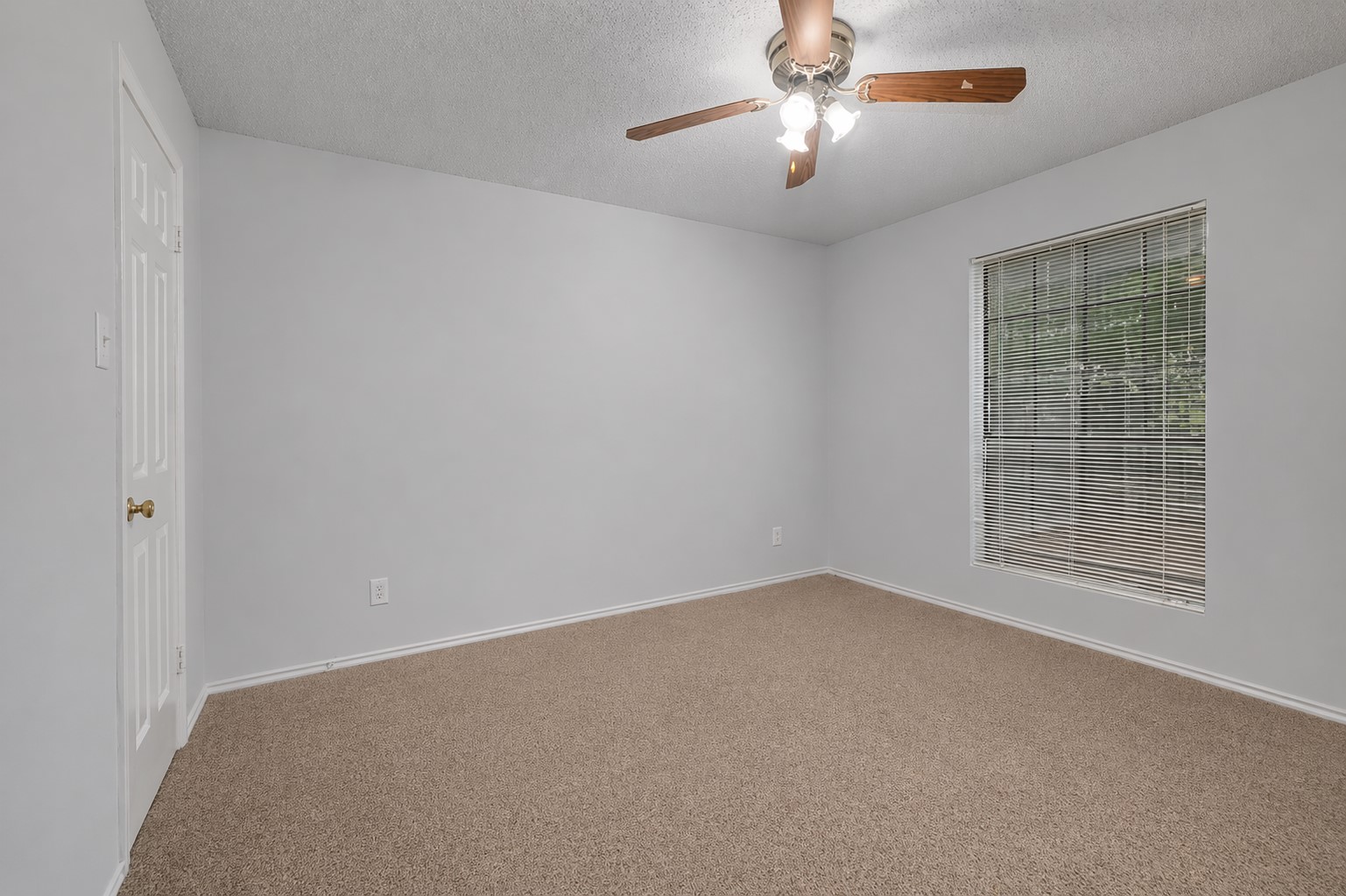2401 Leon Street, Unit 201 Austin, TX 78705 - Photo 8 of 13 a view of an empty room with a window