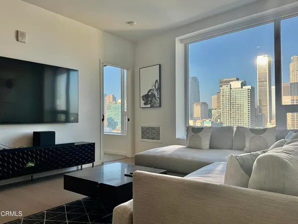 a living room with furniture and a rug