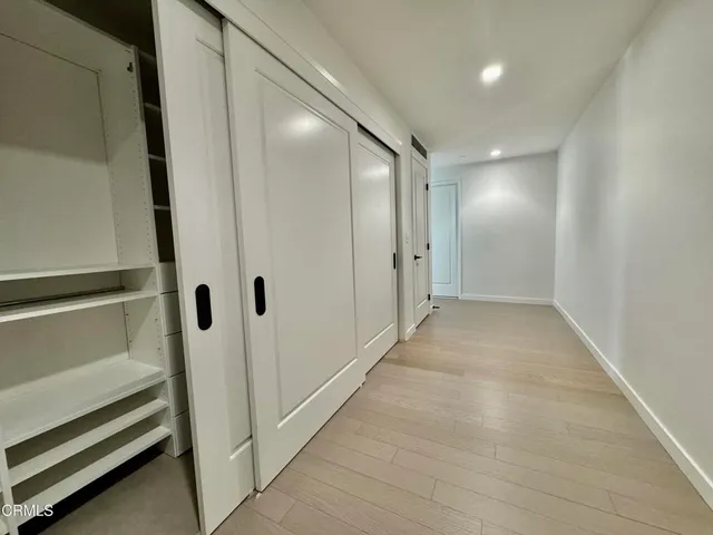 a view of a hallway with closet