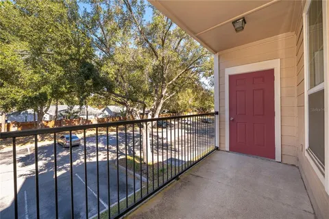 an aerial view of residential house with outdoor space and parking