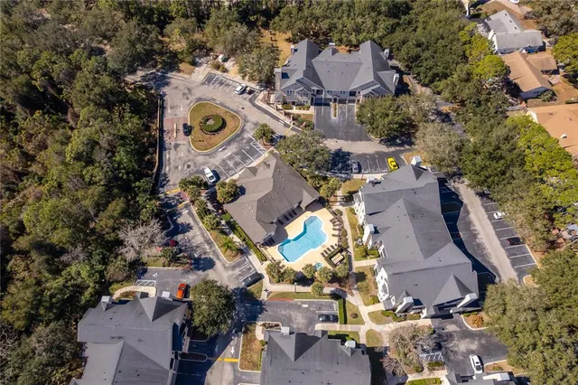 an aerial view of houses with outdoor space