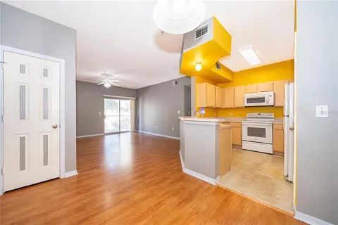a kitchen that has a sink and a stove