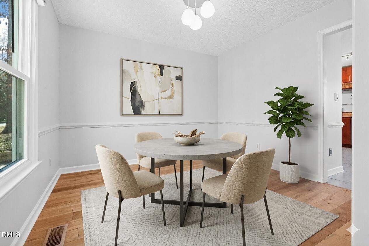 2713 Moorsfield Court Raleigh, NC 27604 - Photo 10 of 46 Virtually Staged Dining Room