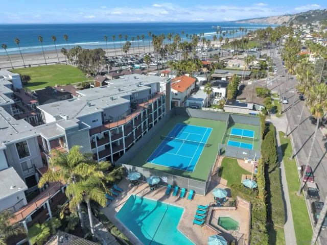 an aerial view of a house with a garden