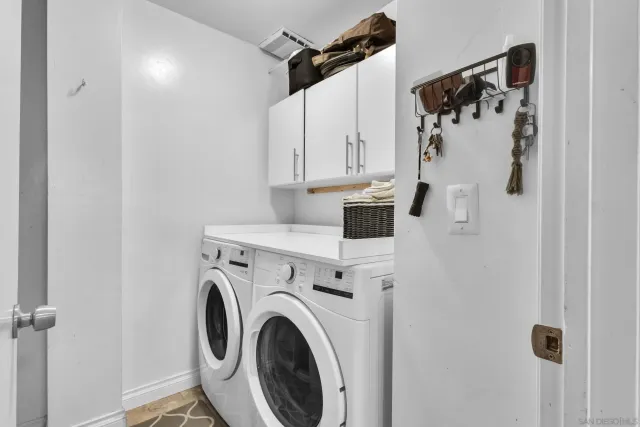 a view of bathroom with washer and dryer