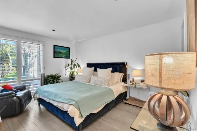 a bedroom with a bed and a couch