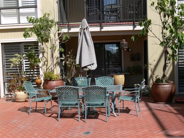 a view of a chairs and table in a patio