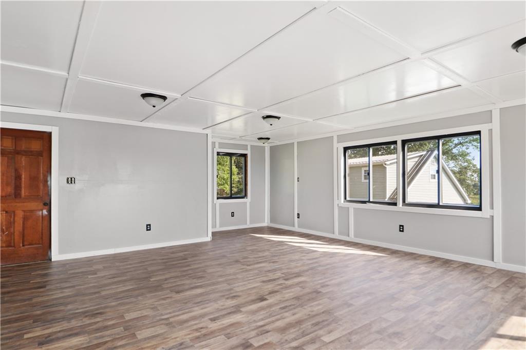 618 Whistler Drive Rochester, PA 15074 - Photo 16 of 29 a view of an empty room with window and wooden floor