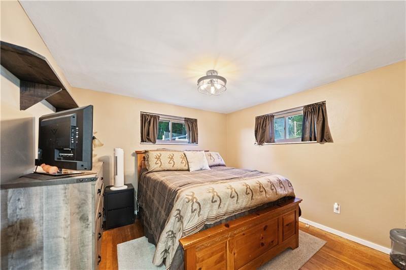618 Whistler Drive Rochester, PA 15074 - Photo 20 of 29 a bedroom with a bed and a flat screen tv