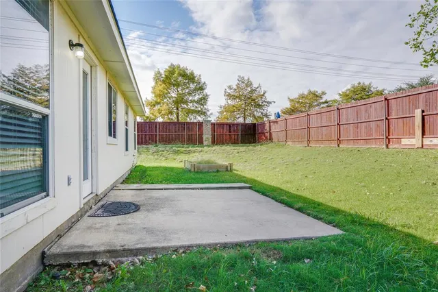 a view of a backyard with a small yard