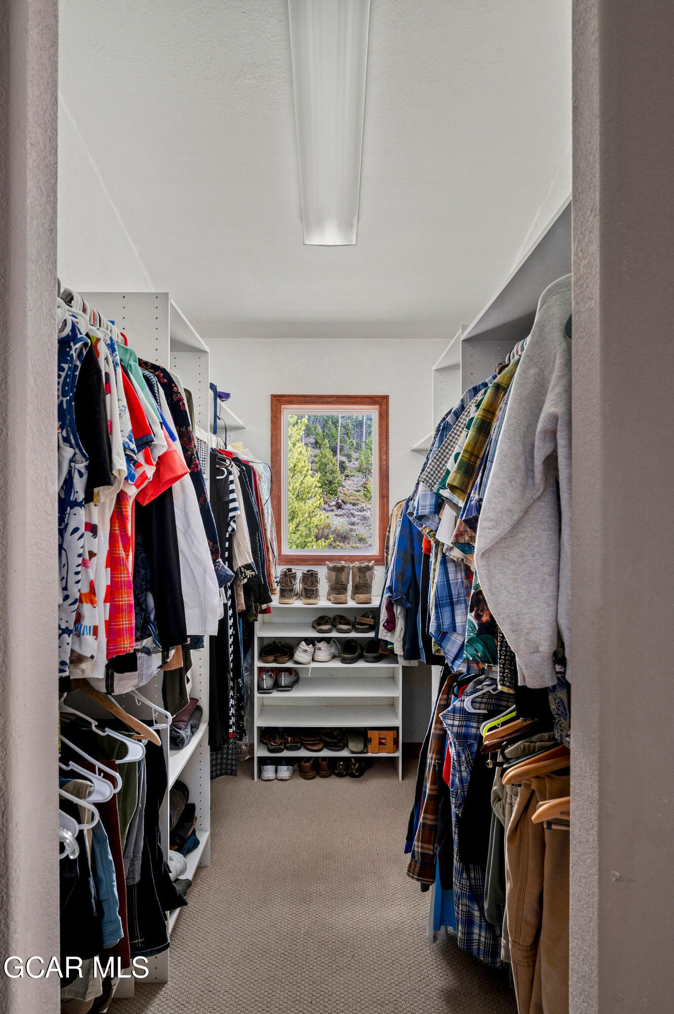 732 Gcr 8311/ Clayton Ranch Road Tabernash, CO 80478 - Photo 41 of 65 a view of walk in closet with clothes and shoes