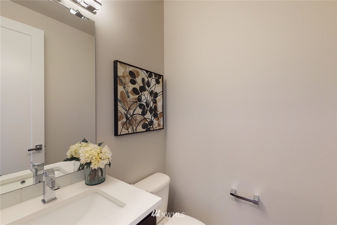 23417 26th Avenue Southeast Bothell, WA 98021 - Photo 21 of 40 a bathroom with a toilet sink and mirror
