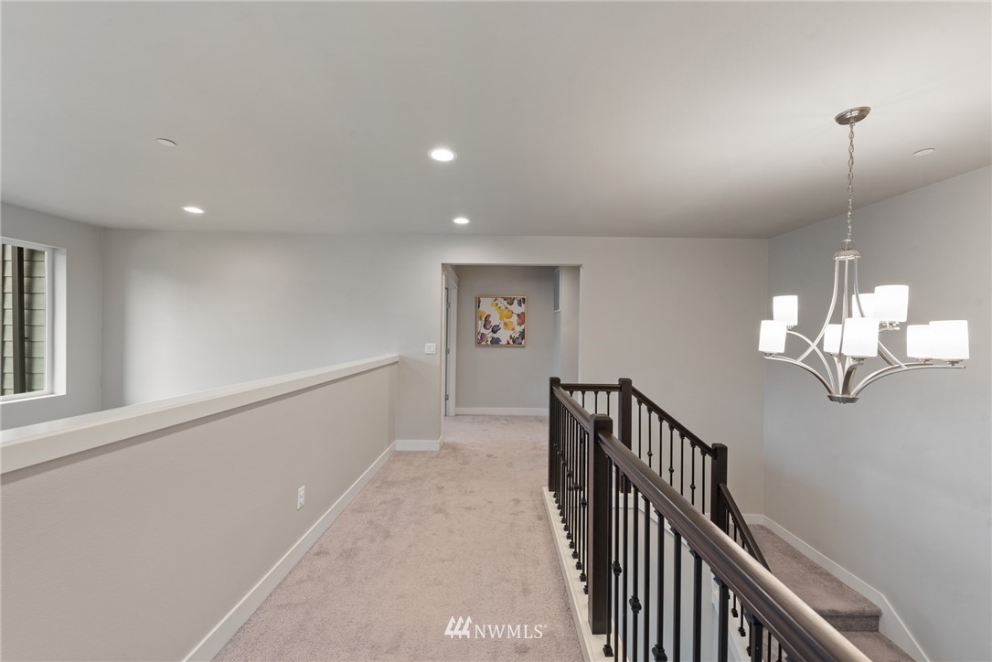 23417 26th Avenue Southeast Bothell, WA 98021 - Photo 23 of 40 a view of a hallway with chandelier