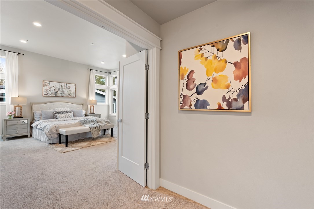 23417 26th Avenue Southeast Bothell, WA 98021 - Photo 24 of 40 a bedroom with a bed and a painting on the wall