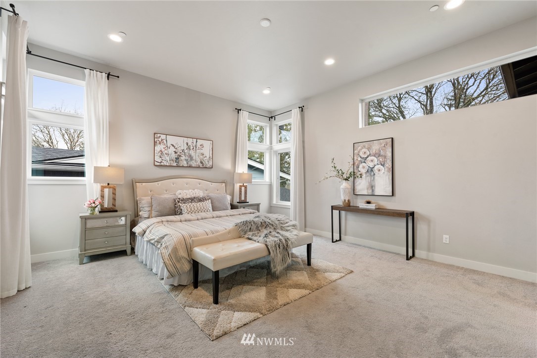 23417 26th Avenue Southeast Bothell, WA 98021 - Photo 25 of 40 a bedroom with a bed and a table