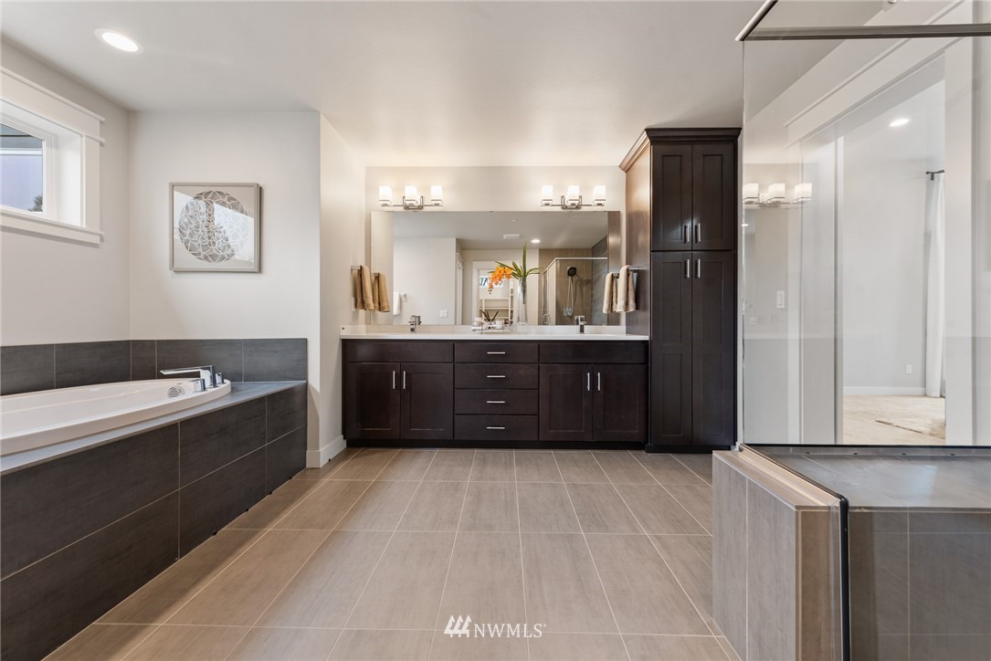 23417 26th Avenue Southeast Bothell, WA 98021 - Photo 28 of 40 a spacious bathroom with a tub sink and mirror