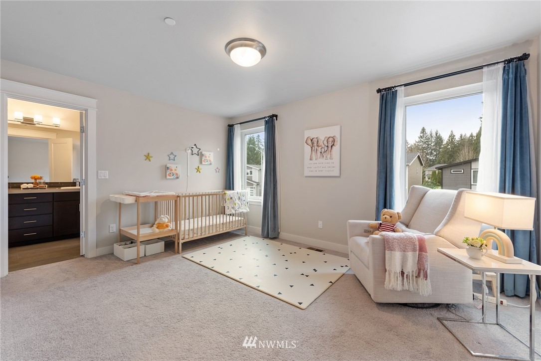 23417 26th Avenue Southeast Bothell, WA 98021 - Photo 30 of 40 a living room with furniture and a large window