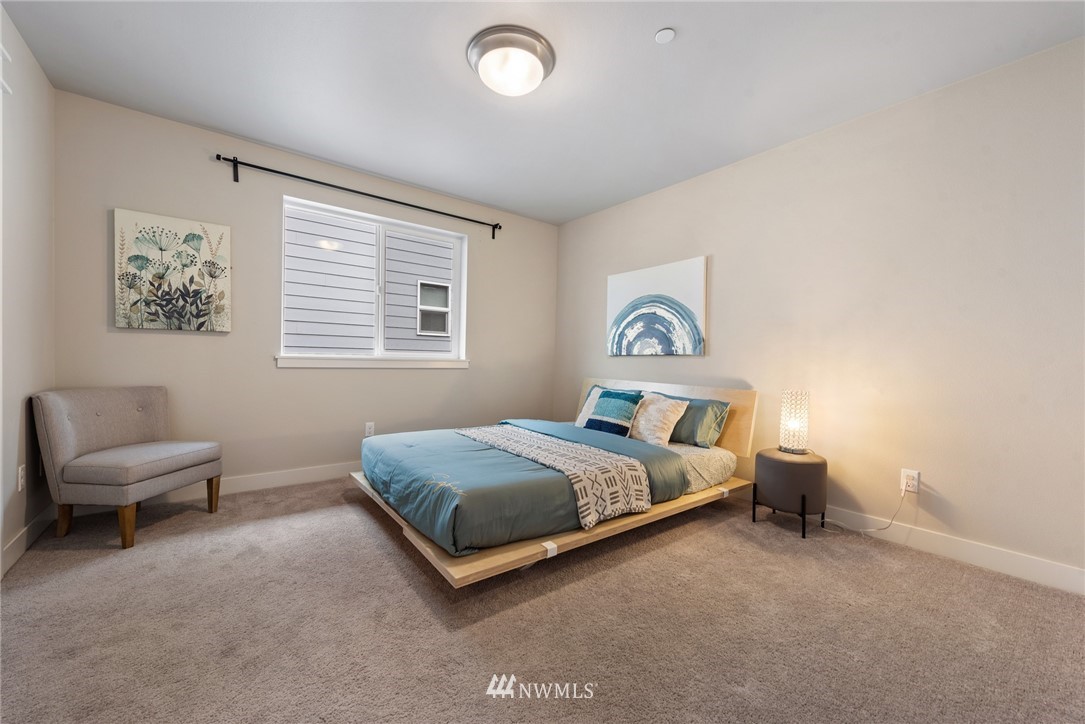 23417 26th Avenue Southeast Bothell, WA 98021 - Photo 32 of 40 a bedroom with a bed and a couch
