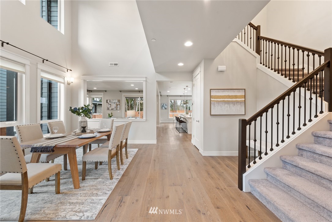 23417 26th Avenue Southeast Bothell, WA 98021 - Photo 5 of 40 a view of a dining room with furniture wooden floor and windows