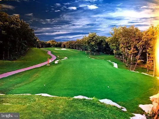 a view of a golf course with a lake