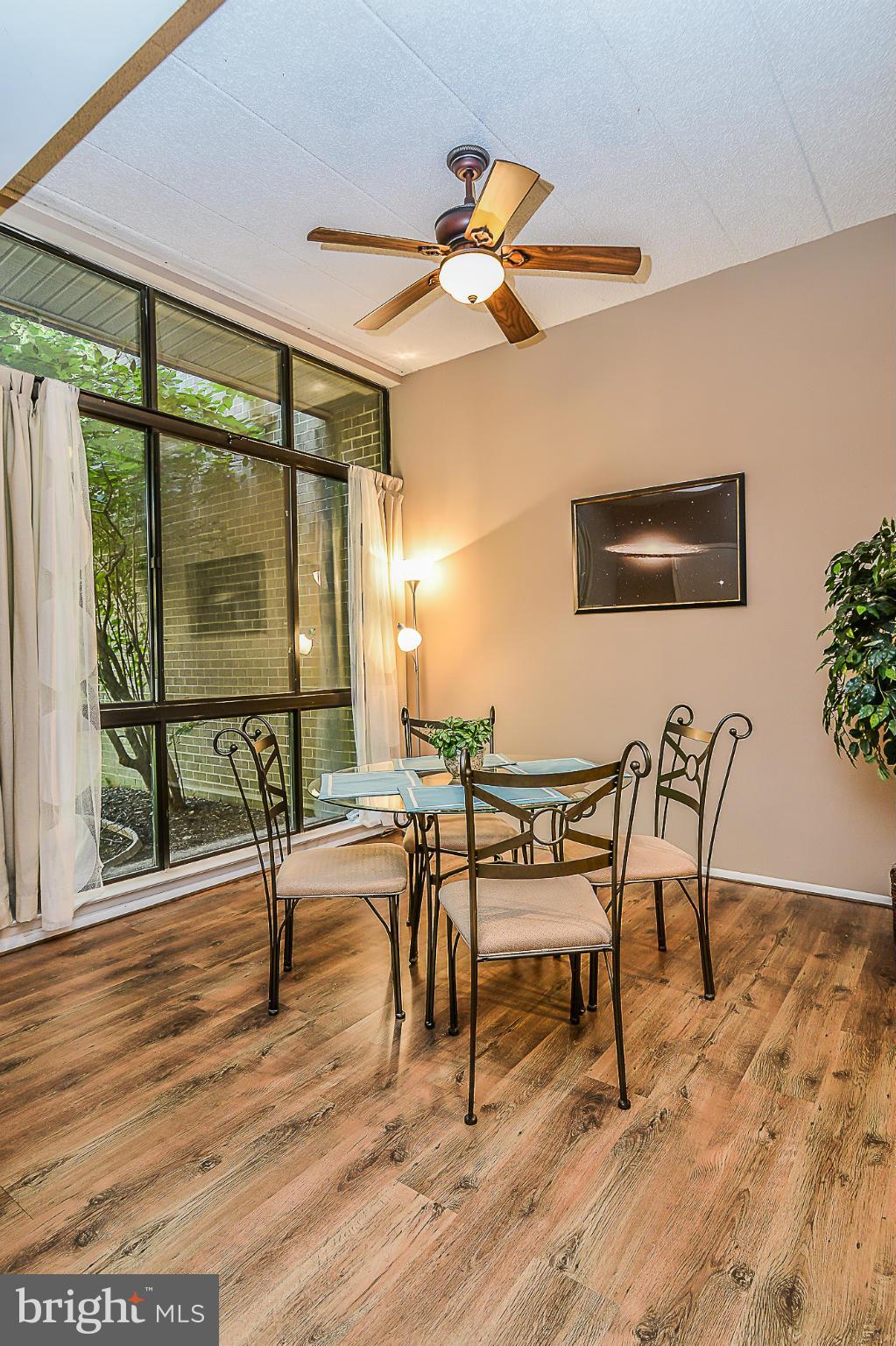 11620 Ivystone Court, Unit 101 Reston, VA 20191 - Photo 11 of 20 a view of a livingroom with furniture and a window